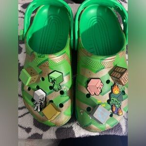 CROCS Kids Green and Tan Slippers with Fun Charms